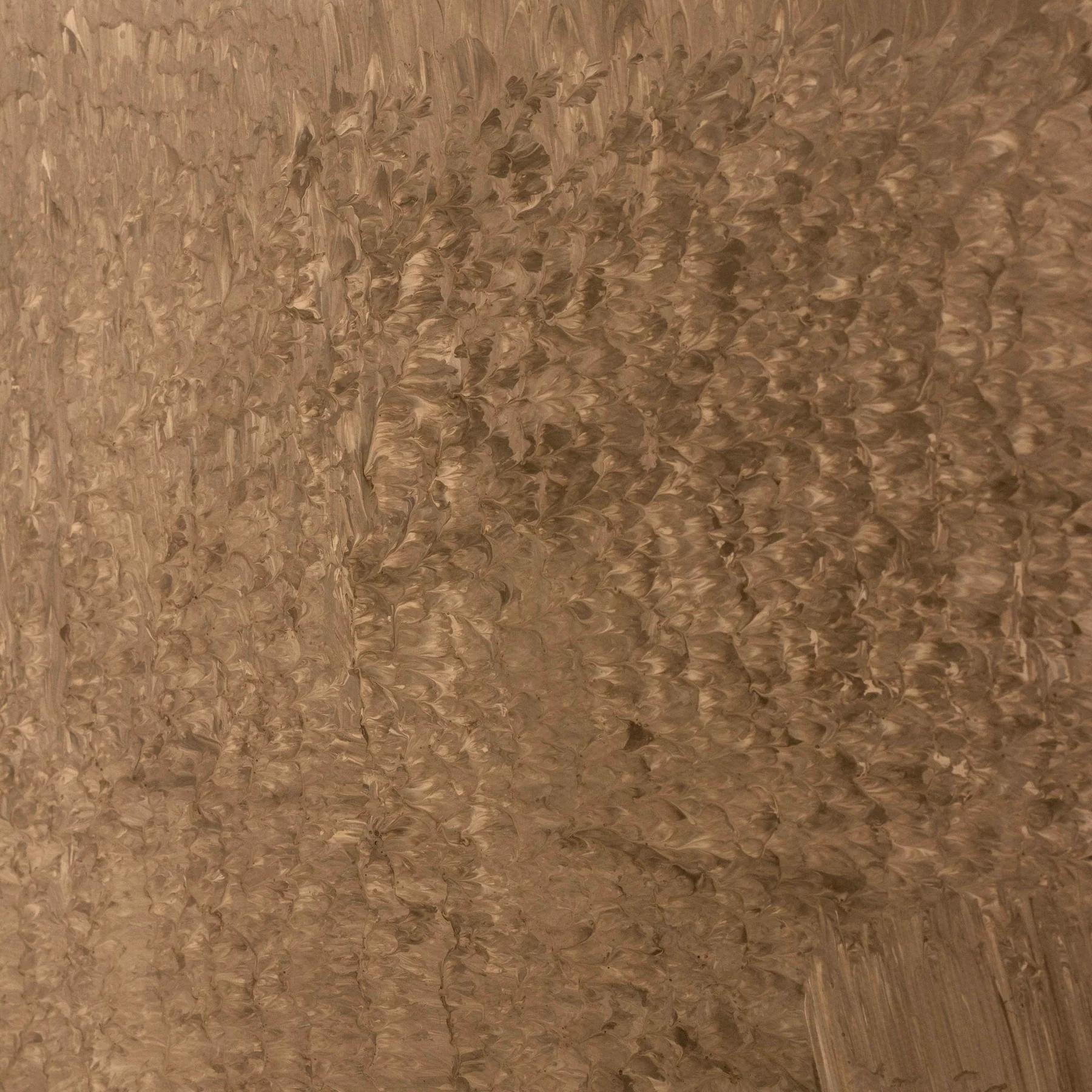 Close-up showing layered brushwork on a green-brown hand-painted canvas